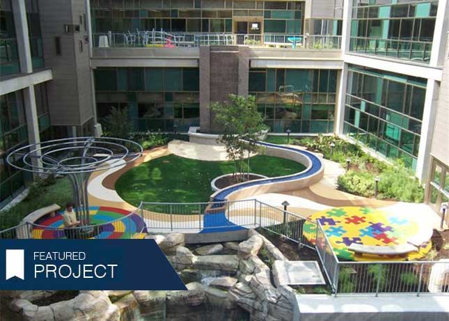 Poured-in-Place Safety Surfacing with a colorful puzzle piece pattern by Kraftsman at Dell Children's Hospital