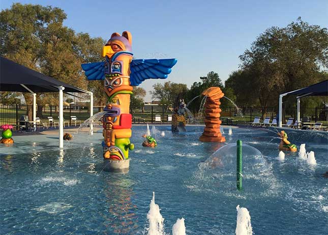 Aquatic Playground Equipment in the shape of totem poles and rock formations by Kraftsman