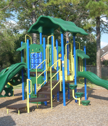 Commercial Playground Equipment in a Park installed by Kraftsman