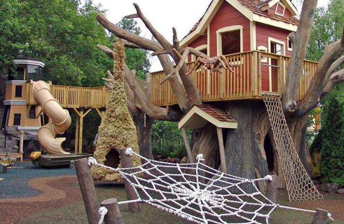 A Themed Playground with spider web climbing nets by Kraftsman
