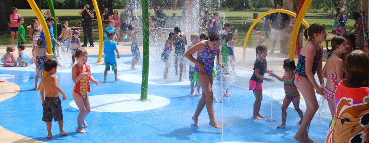 Kids playing at a Commercial Splash Park Designed by Kraftsman