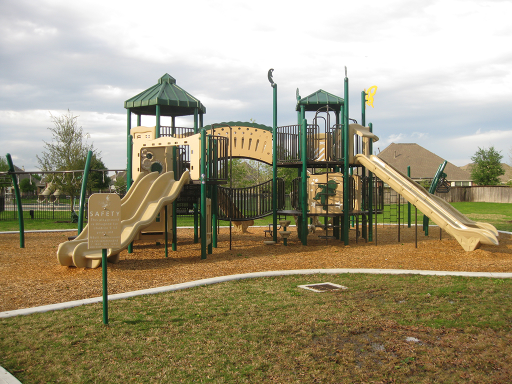 Cypress, TX Blackhorse Ranch Playground Design Build by Kraftsman