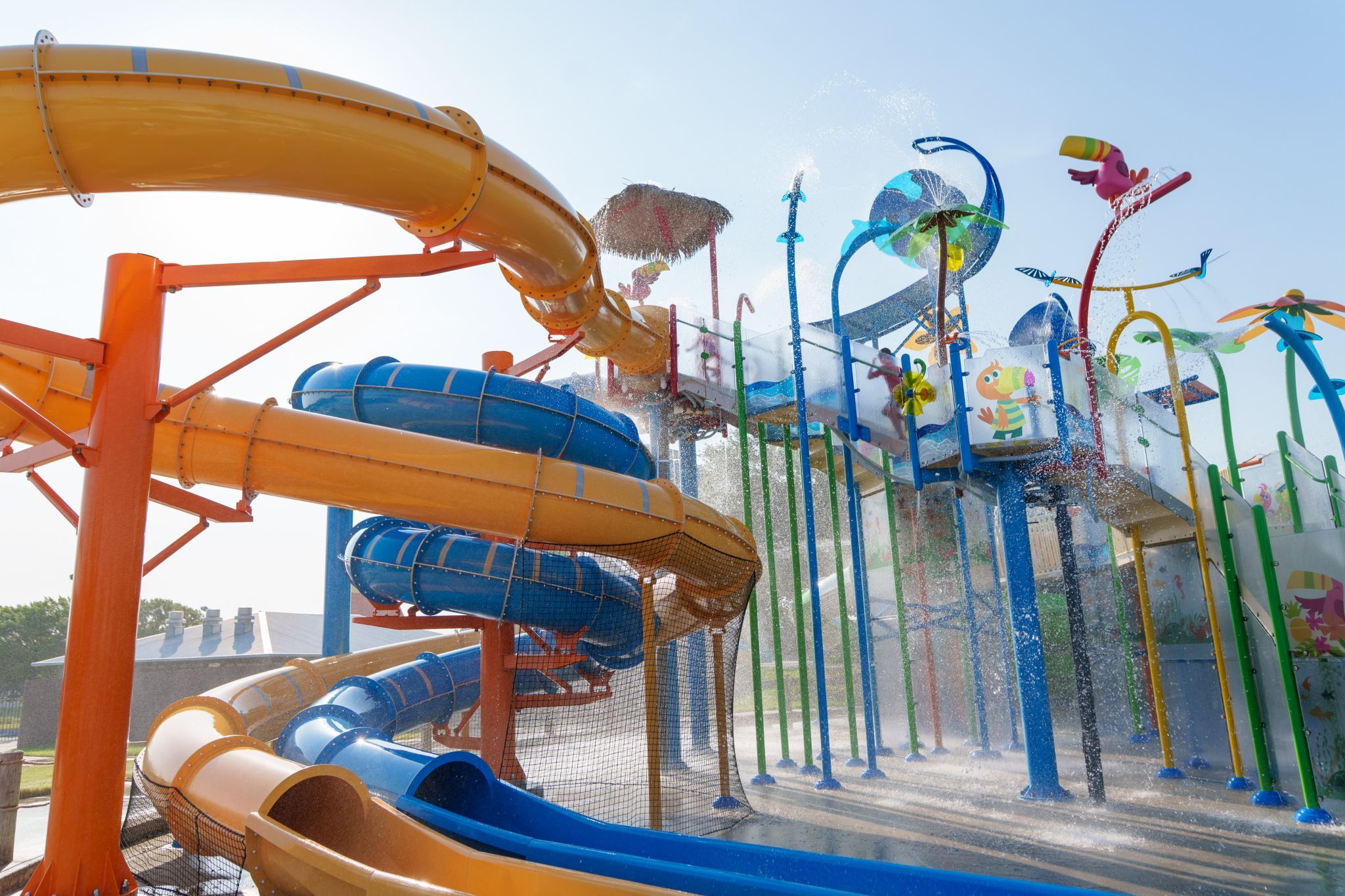 Bahama Beach Waterpark's Elevations aquatic play structure with colorful waterslides in Dallas, Texas