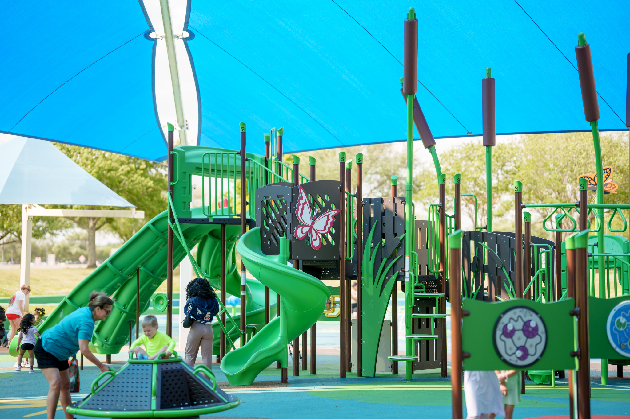 Children playing on marsh-themed playground