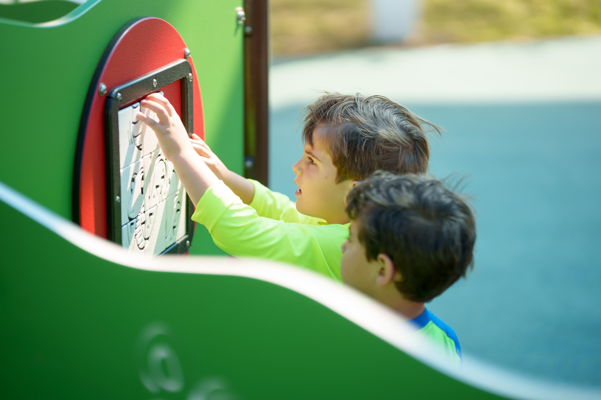 children playing on playground interactive panels