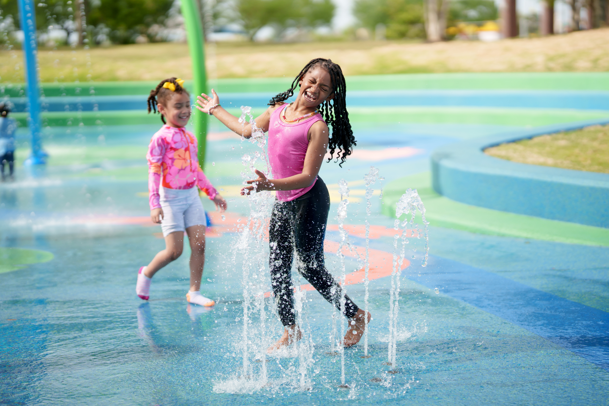 child playing on splash pad