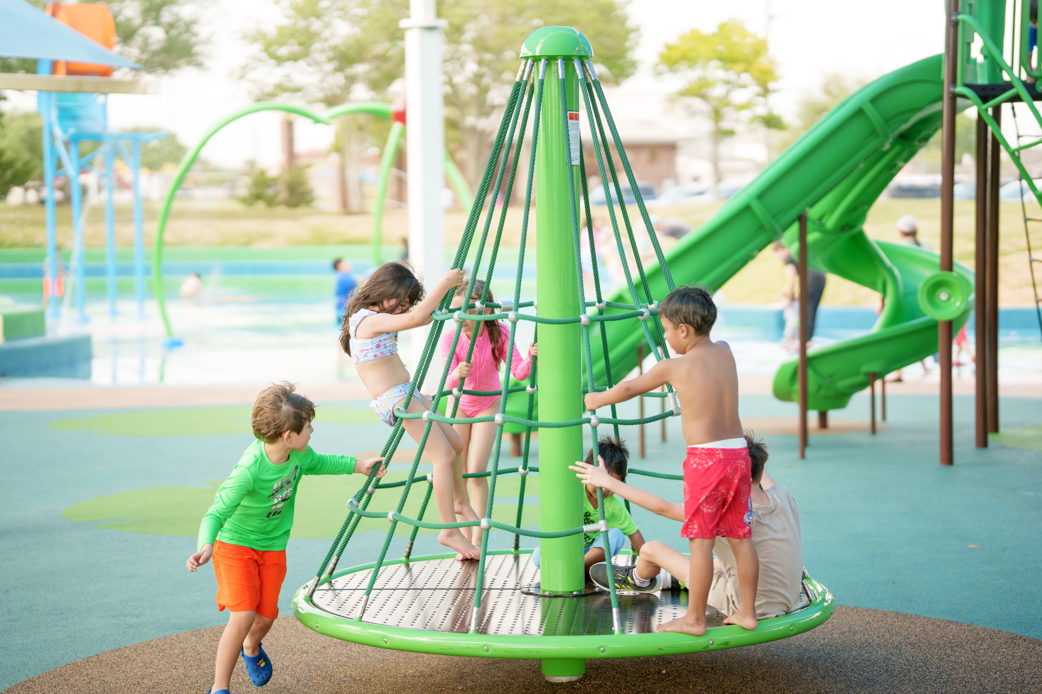children playing on whirl wind rope climber