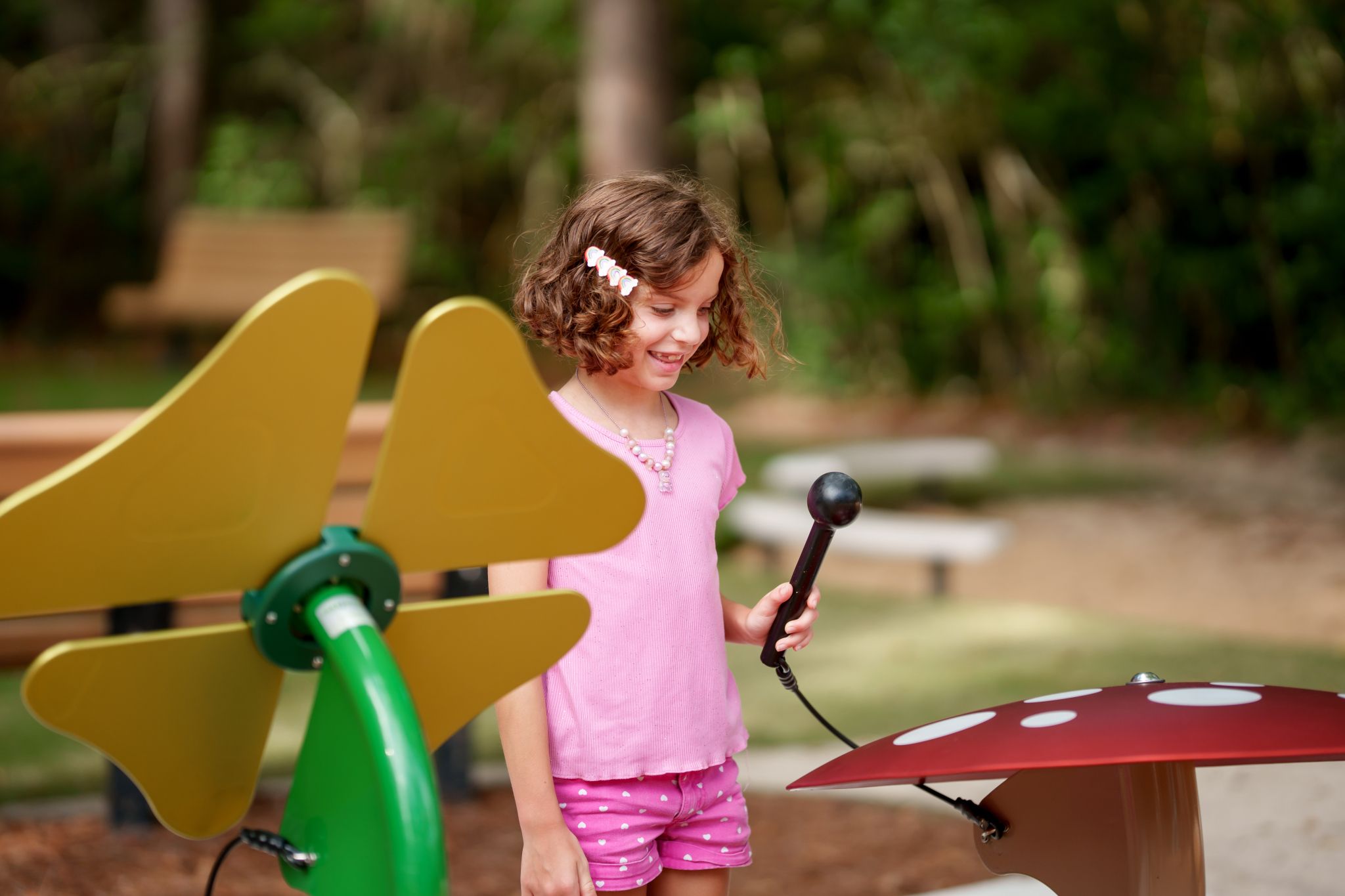 child playing on musical instruments in The Falls at Imperial Oaks