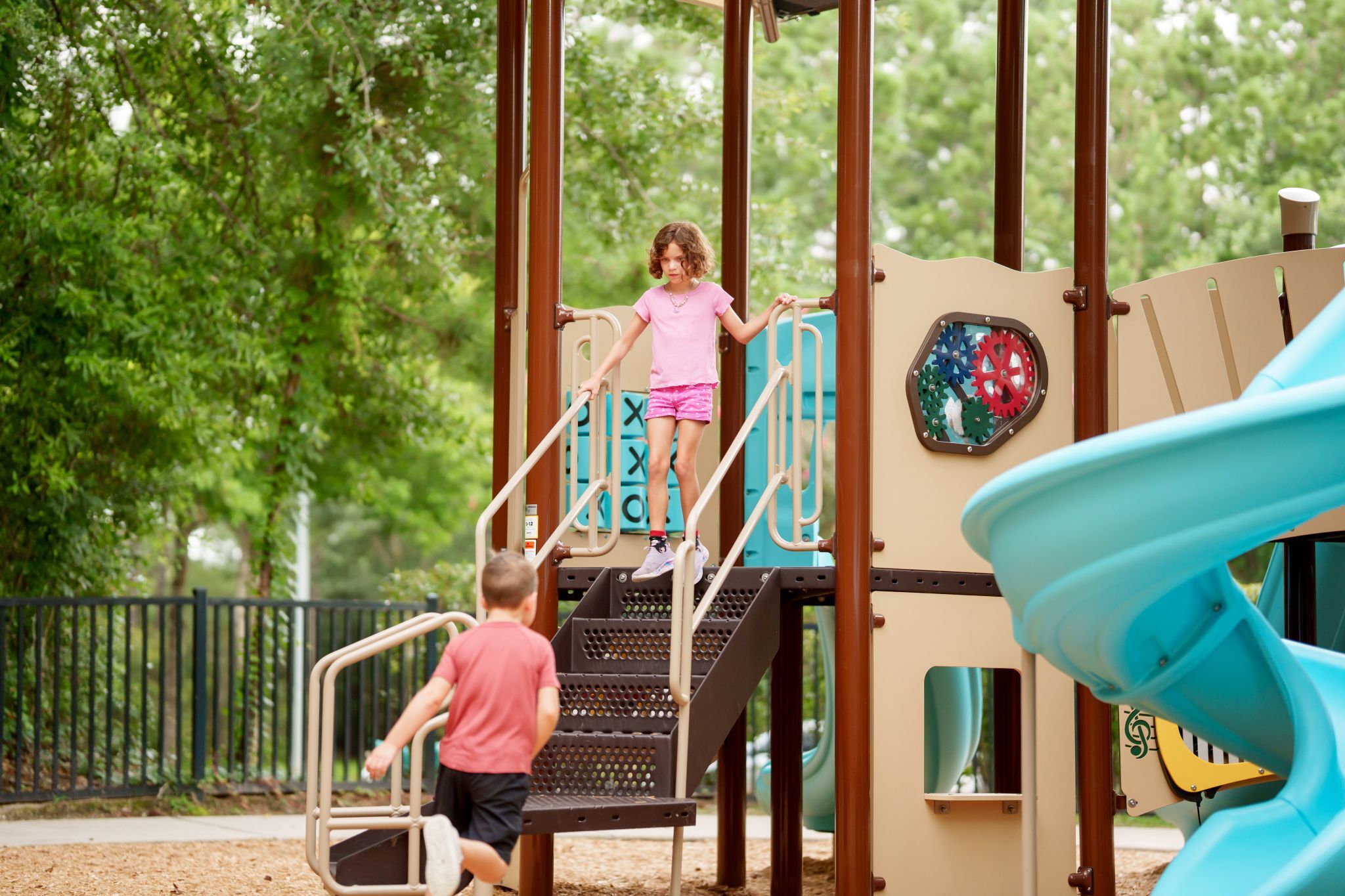 children playing on playground in The Falls at Imperial Oaks
