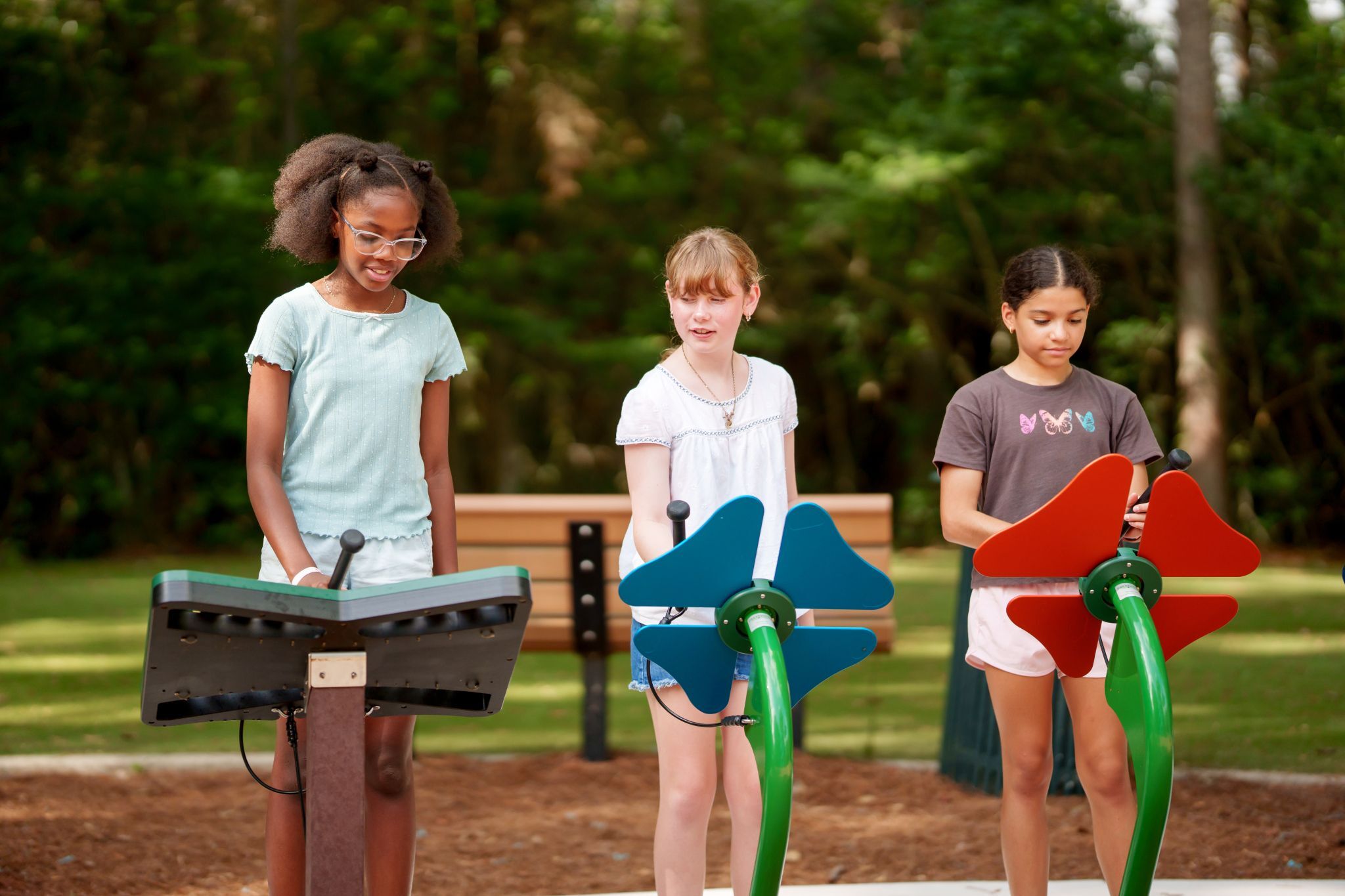 Children playing on the musical play in The Falls at Imperial Oaks